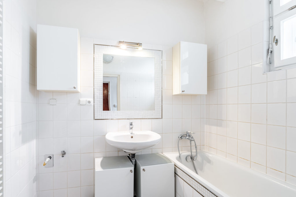 a bathroom in an apartment of a residential building