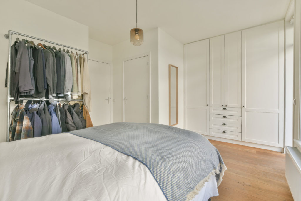 Bed near closet in bedroom