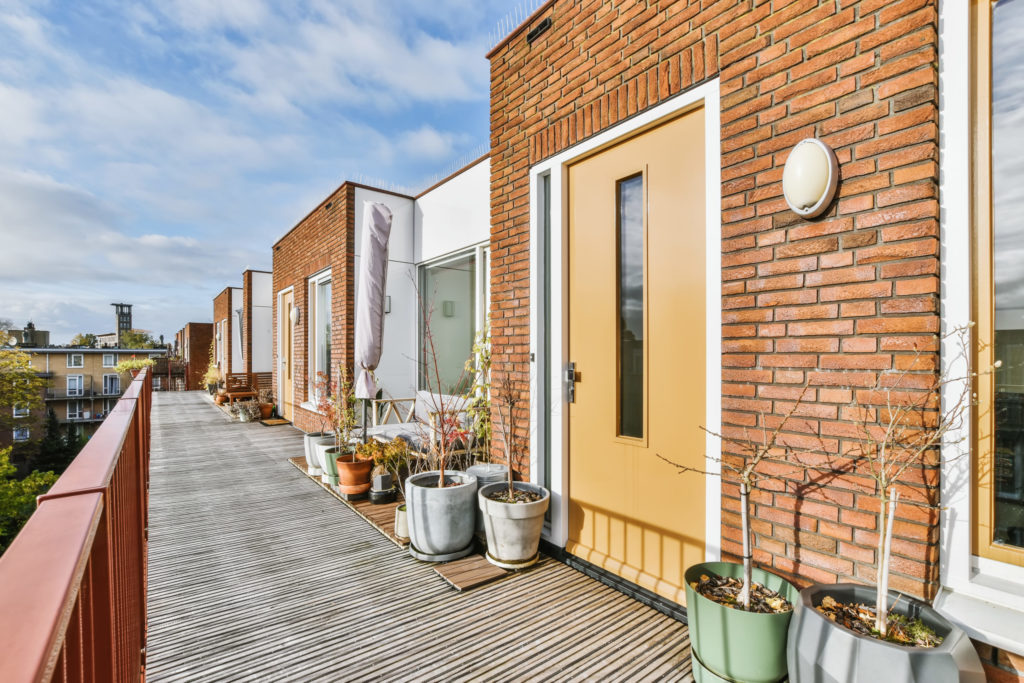 Entrance doors to apartments with large pots