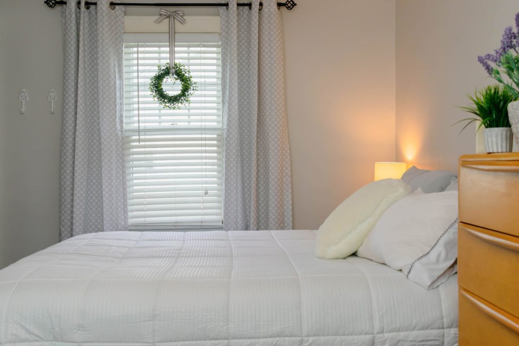 Mid century modern dresser in gray and white bedroom